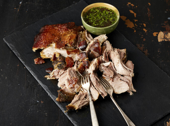 This Puerto Rican pork roast boasts tender meat and crackling, crisp skin